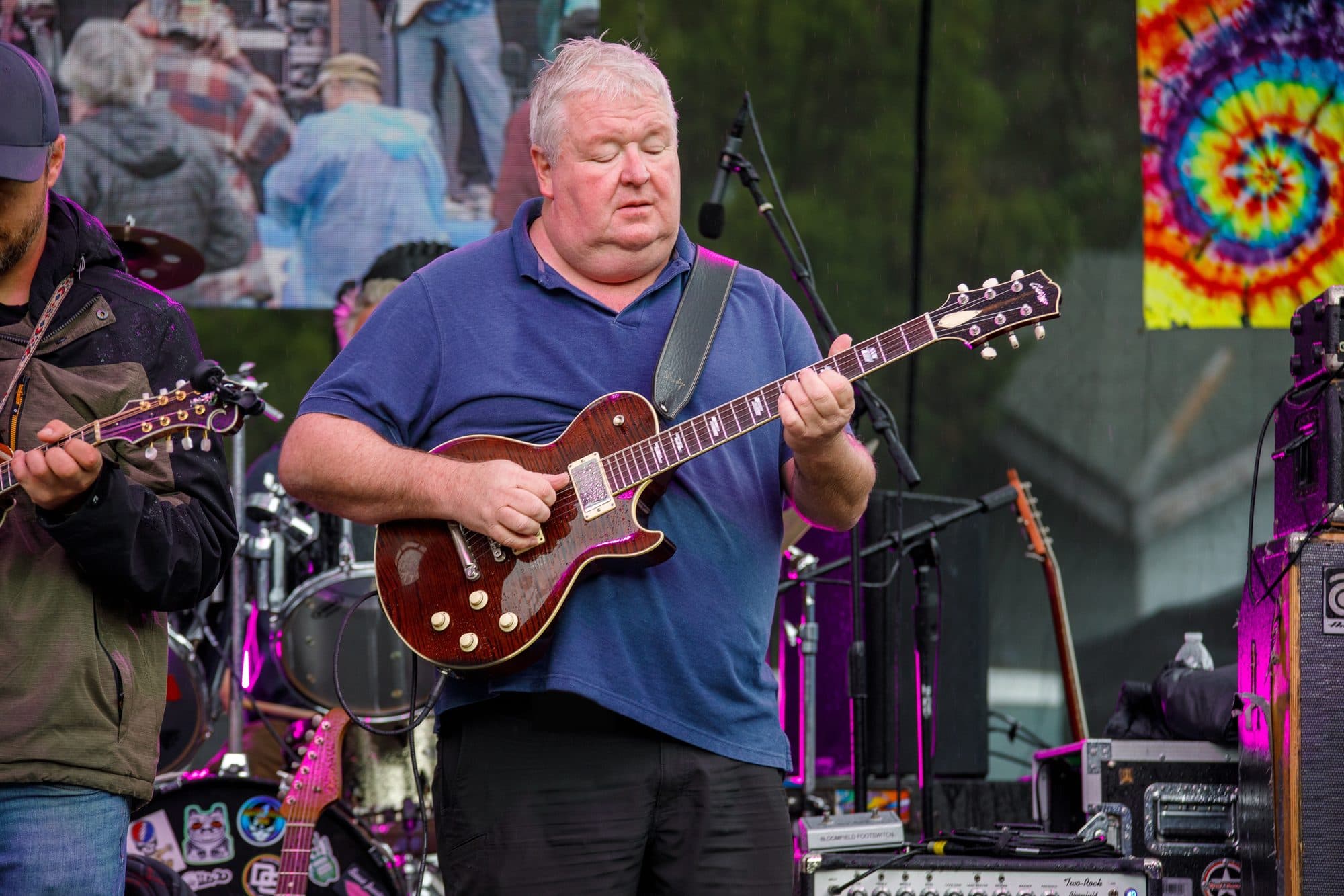 JP Blake performing in the rain with Hempstring at June Lake Jam Fest
